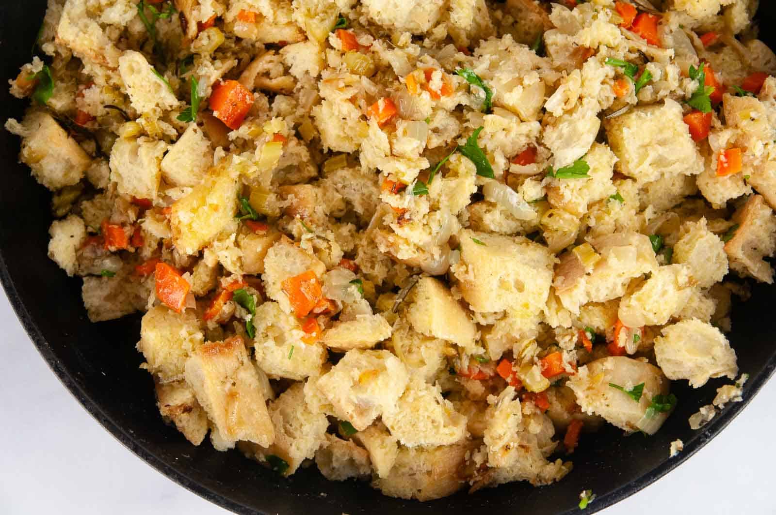 Garlic Herb Ciabatta Stuffing (Vegetarian) in a cast iron skillet makes a lovely side dish for the holidays.