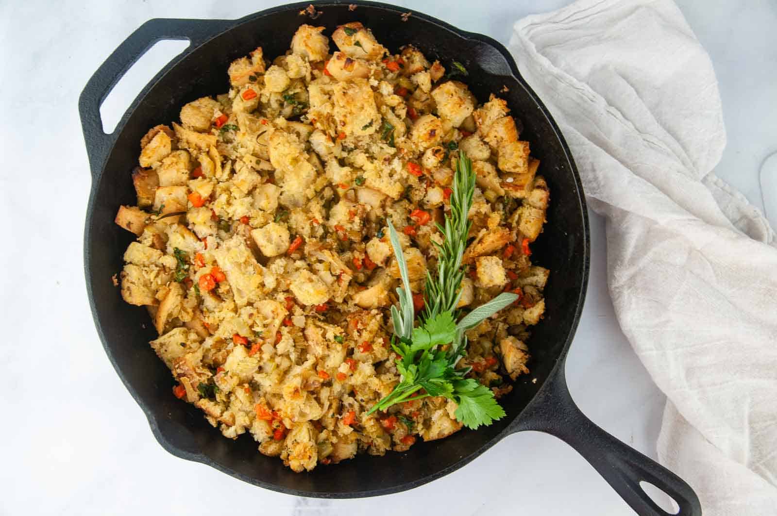 Garlic Herb Ciabatta Stuffing (Vegetarian) in a cast iron skillet makes a lovely side dish for the holidays.