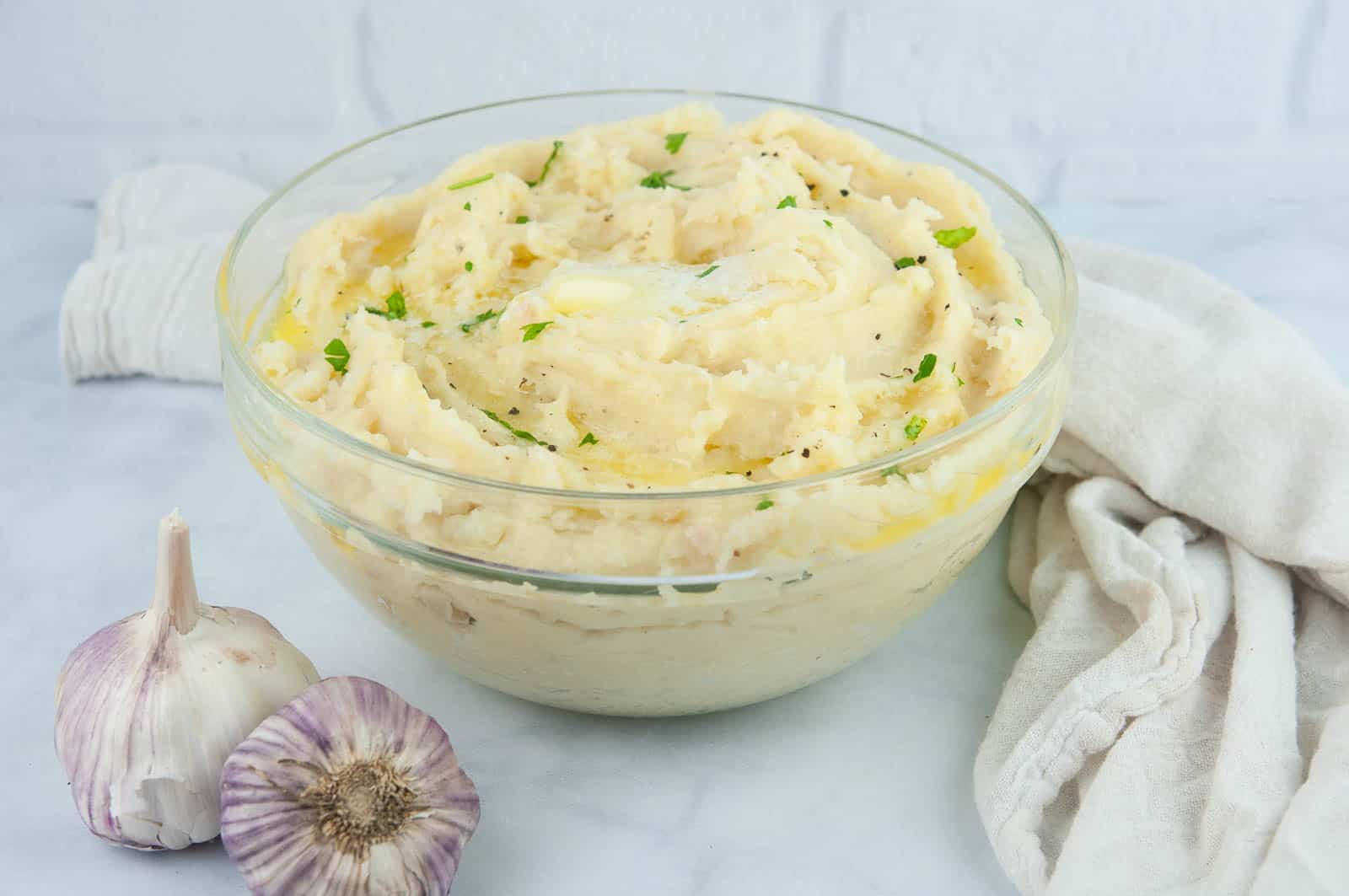 Fluffy roasted garlic mashed potatoes are buttery and a perfect side for a holiday dinner or Sunday roast.