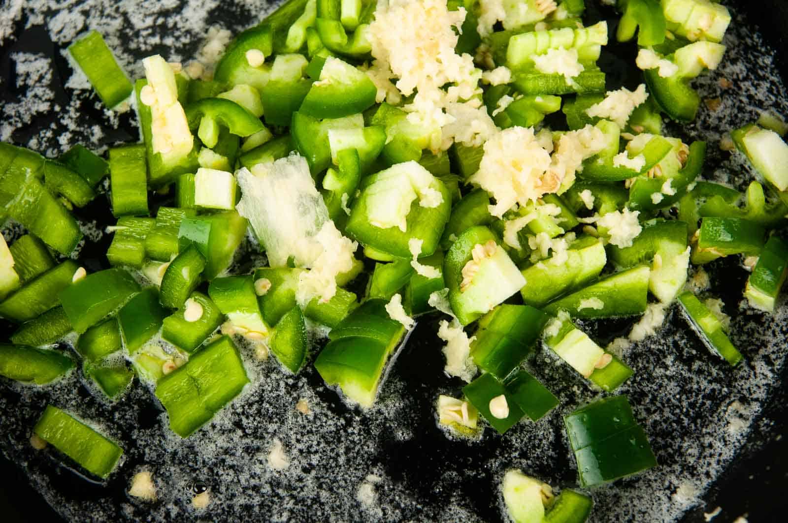 Saute the jalapenos and garlic.