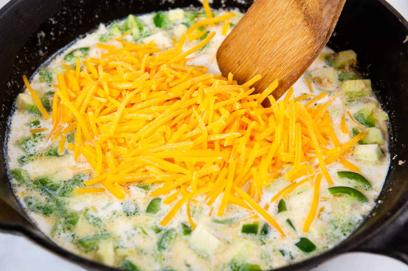 Stir in the cheddar cheese.