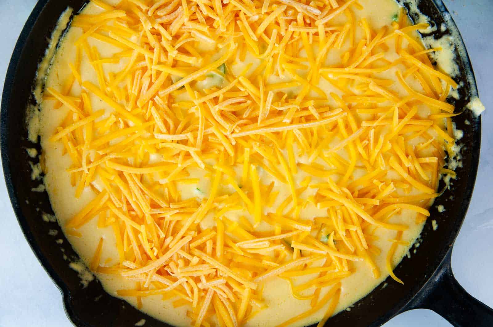 Top the dip with shredded cheese.