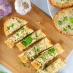 a photo of sliced cheesy garlic bread on a cutting board set into a text box reading Easy Cheesy Garlic Bread