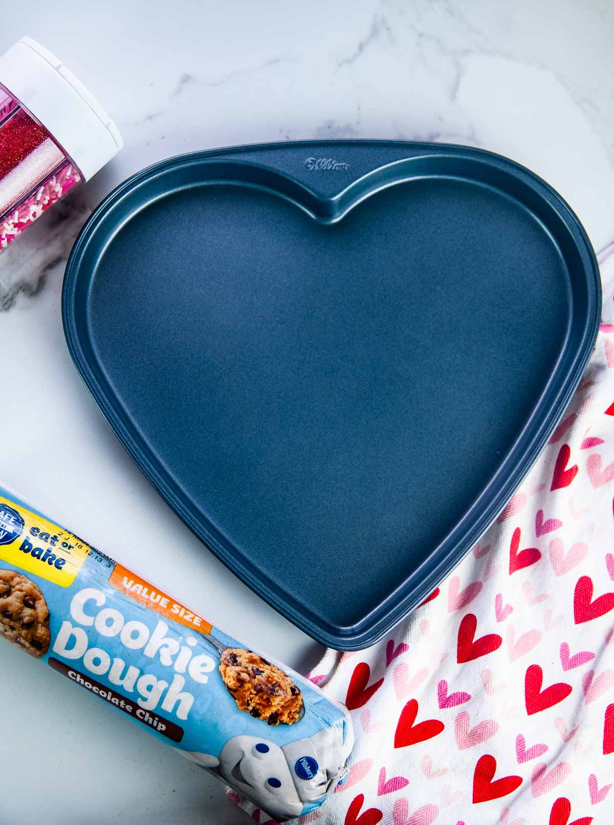 https://www.seasonedsprinkles.com/wp-content/uploads/2023/01/Giant-Heart-Cookie-for-Valentines-Day-14.jpg