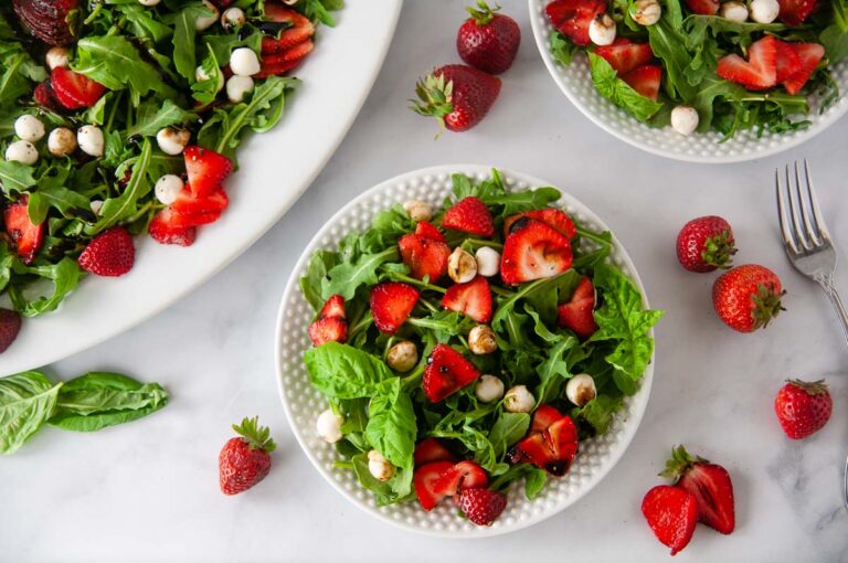 Strawberry Caprese salad is a classic summer meal. This light dish bursts with the sweetness of the fresh berries and basil, spicy arugula and creamy bites of mozzarella. A sweet balsamic drizzles coats adds the finishing touch.