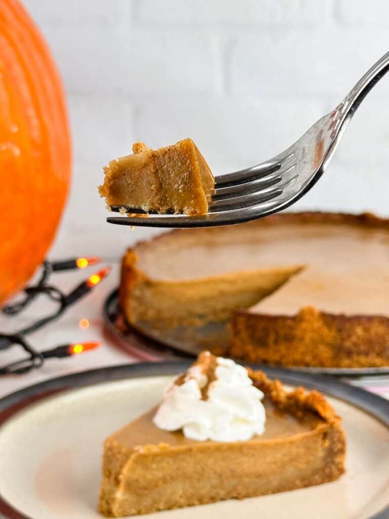 Pumpkin pie with graham cracker crust is a lovely holiday dessert with creamy pumpkin custard on top of crunchy graham crust.