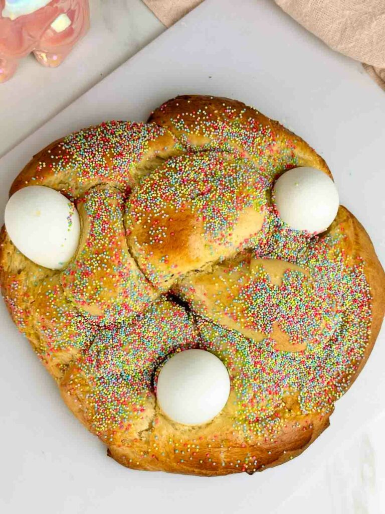 Italian Easter bread is a traditional slightly sweet brioche style perfect for the springtime holiday. This fluffy, braided bread dotted with eggs and sprinkles is a festive addition to your Easter brunch.