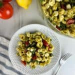 Caprese tortellini pasta salad with pesto is a fresh take on pesto pasta salad. Pillowy cheese tortellini gets tossed with lemon pesto, sweet cherry tomatoes, fragrant basil, and creamy mozzarella for a delicious cold pasta dish you'll love!