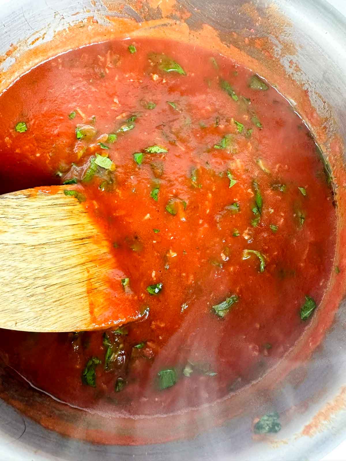 Stir the the basil into the spaghetti sauce.