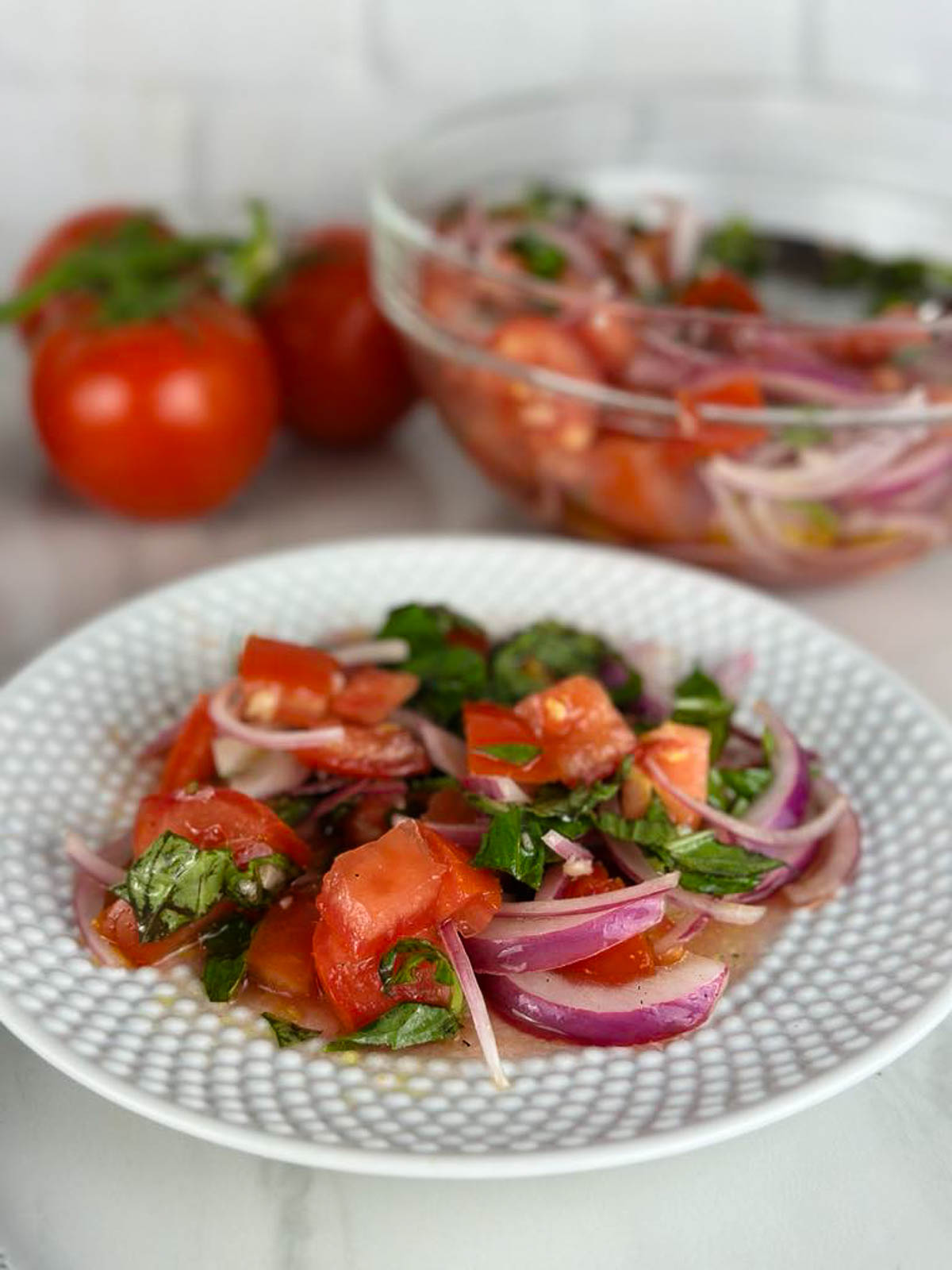Tomato and onion salad with vinegar is a refreshing light lunch or delicious side dish or starter for any meal.
