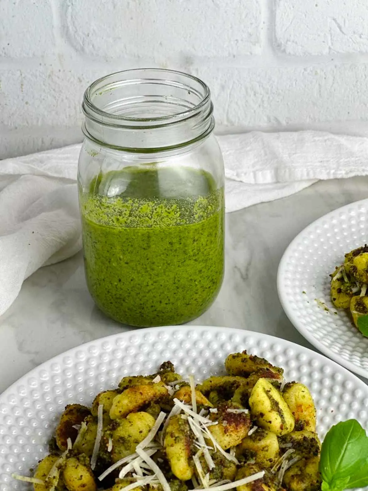 Basil pesto sauce with walnuts is a delicious addition to gnocchi.