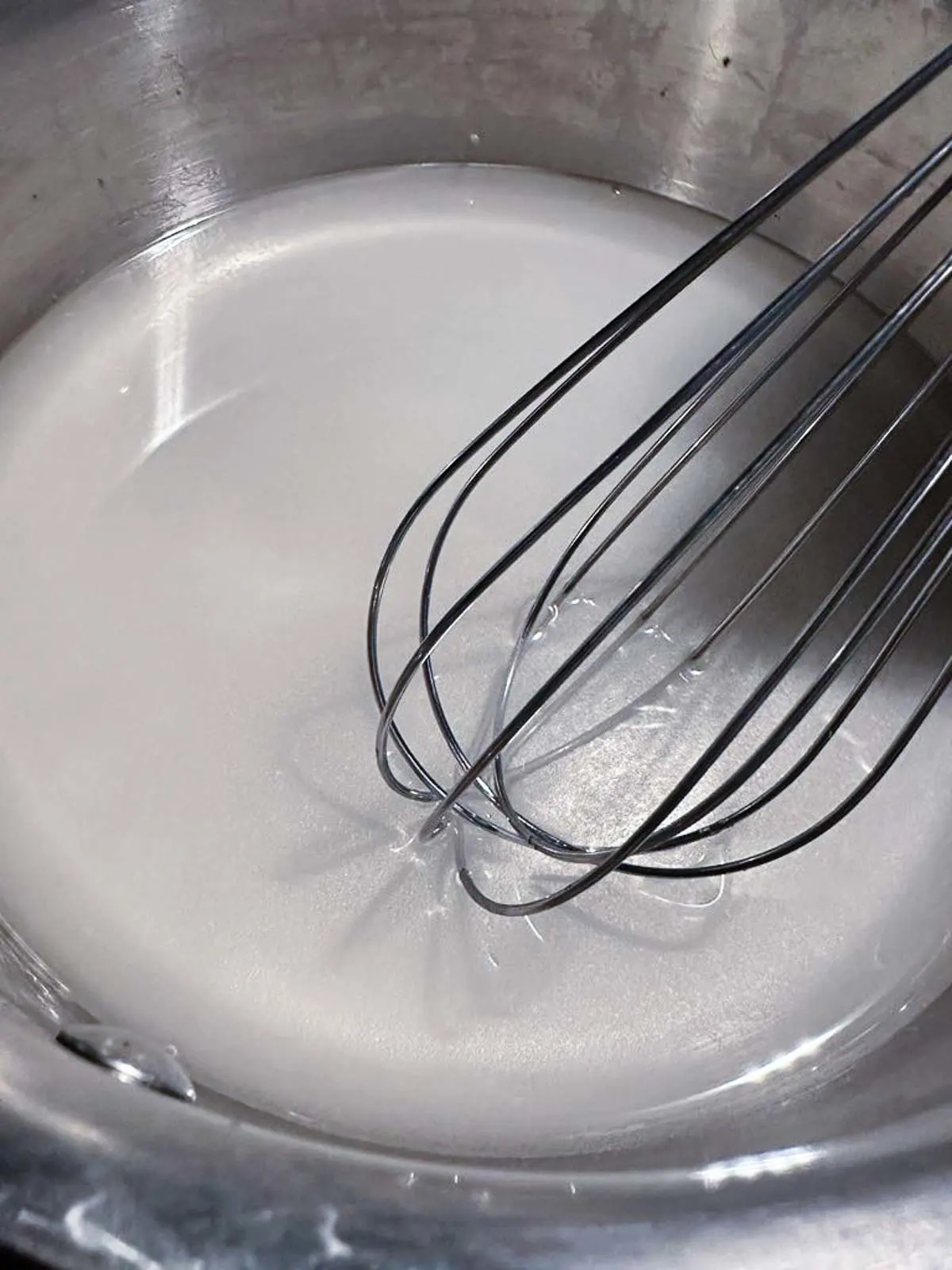 Whisk the sugar and water together in a pot over medium low heat until the sugar dissolves