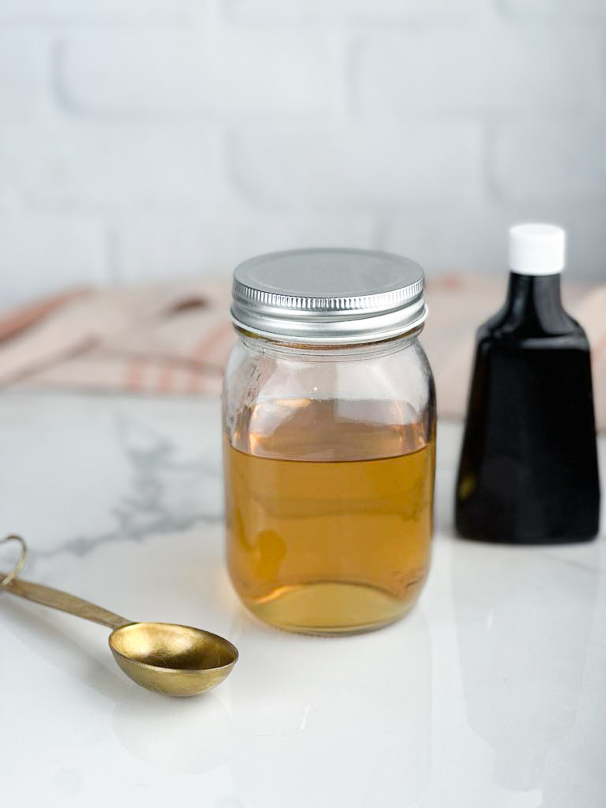 A jar of vanilla simple syrup ready to be used in baked goods or drinks