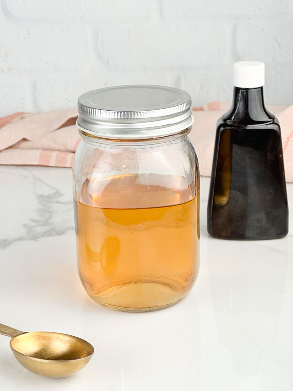 A jar of vanilla simple syrup ready to be used in baked goods or drinks