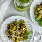 Baked gnocchi with pesto sauce features the Italian dumplings baked to crunchy perfection on a sheet pan before being tossed with fragrant pesto. Gnocchi and pesto sauce is an easy dinner any time.
