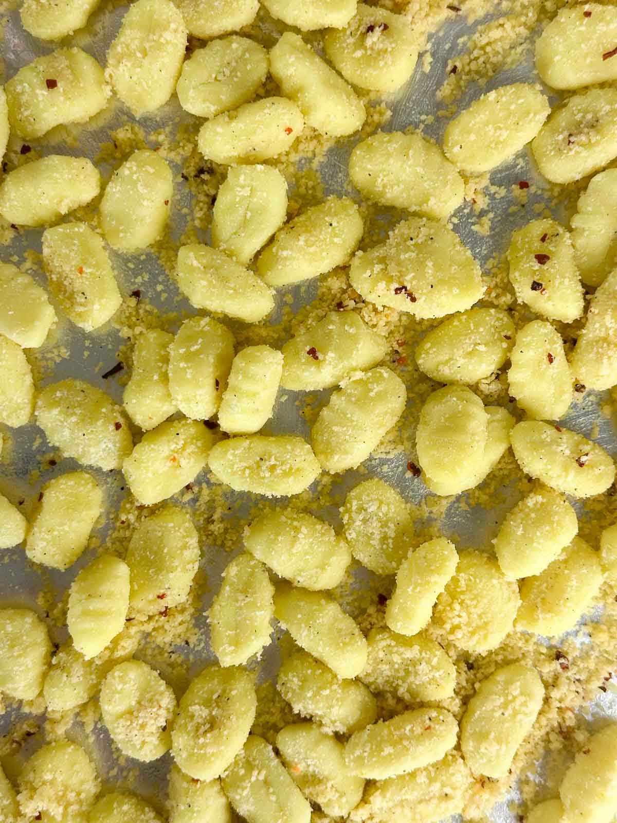Spread the coated gnocchi out on a baking sheet lined with foil.
