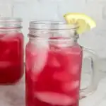 A photo of 2 mason jar mugs of blueberry lemonade set into a text box reading blueberry lemonade