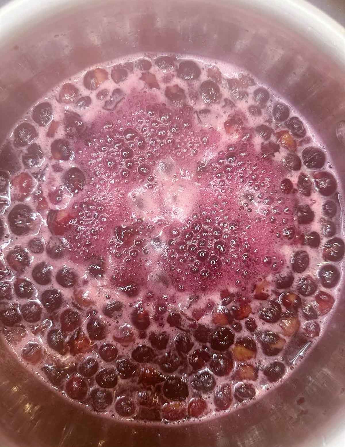 Let the blueberries simmer until the liquid is purple and the berries start to burst