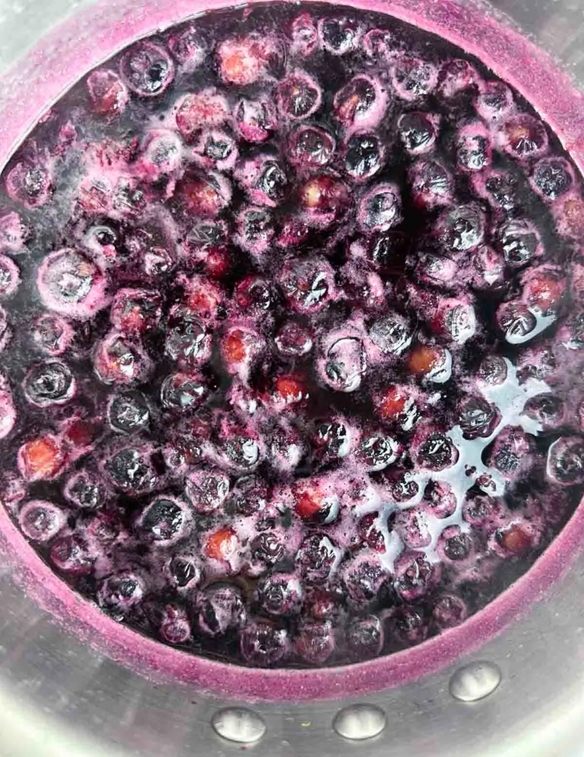 Blueberry simple syrup ready to be strained