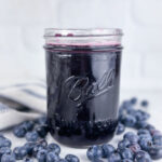 A jar of blueberry simple syrup