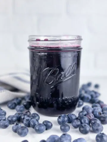 A jar of blueberry simple syrup