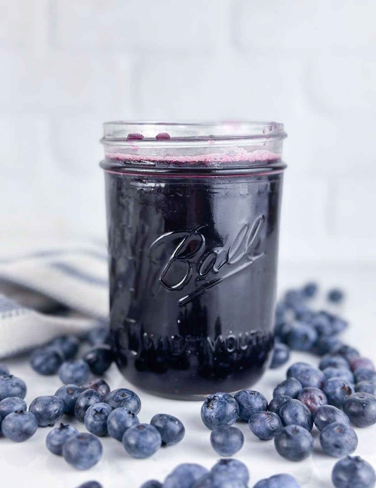 A jar of blueberry simple syrup