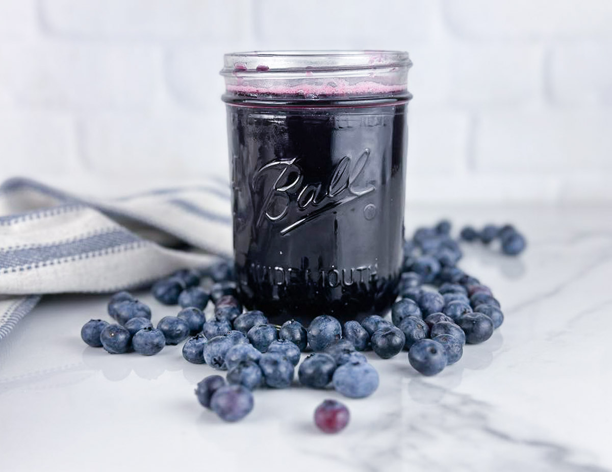 A jar of blueberry simple syrup