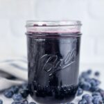 A photo of a jar of blueberry simple syrup set into a text box reading blueberry simple syrup