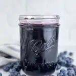 A photo of a jar of blueberry simple syrup set into a text box reading blueberry simple syrup