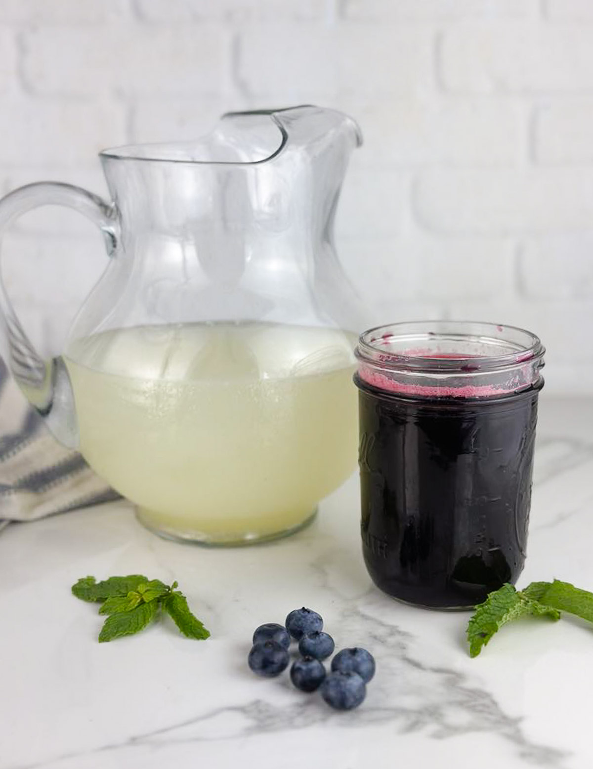 Ingredients for blueberry lemonade: blueberry simple syrup and low sugar lemonade