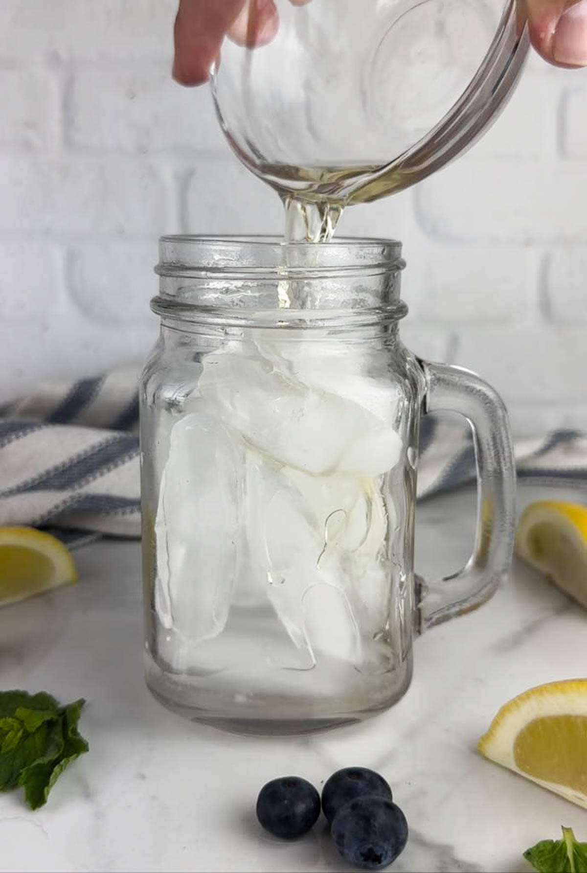 Add the limoncello and vodka to a glass with ice.