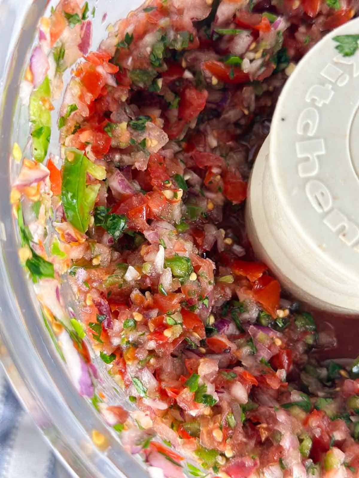 Food process this fresh tomato salsa recipe for a thinner consistency.