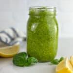 A jar of homemade lemon pesto sauce