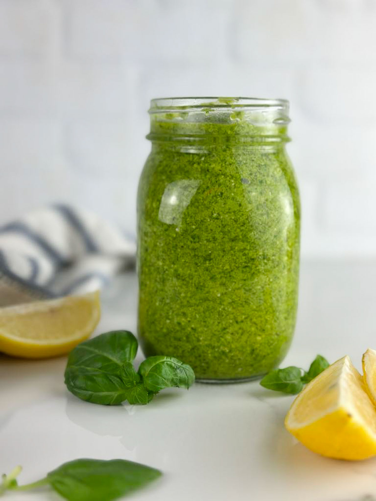 A jar of homemade lemon pesto sauce