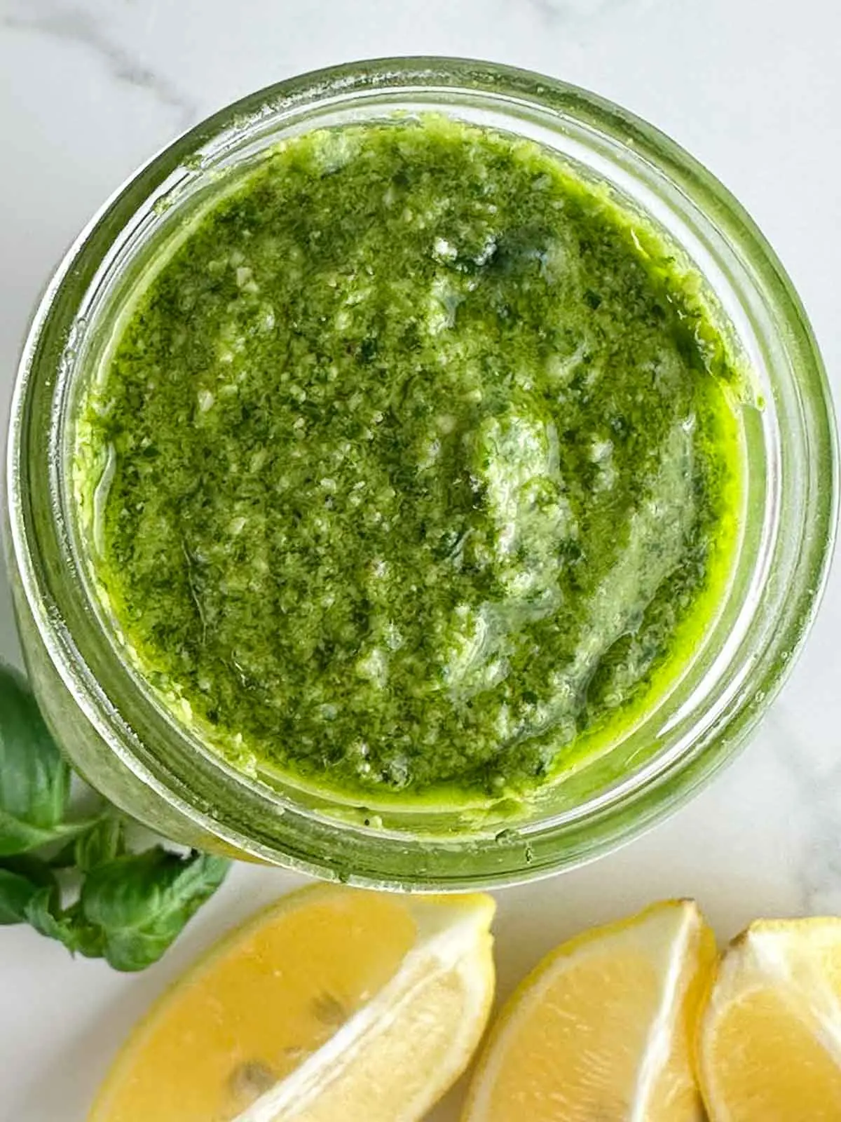 A jar of homemade lemon pesto sauce