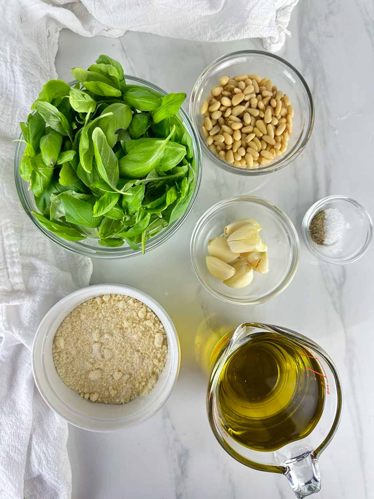 Ingredients for Traditional Pesto Genovese: Basil, Pine Nuts, Garlic, Parmesan Cheese, Olive Oil, Salt, and Pepper