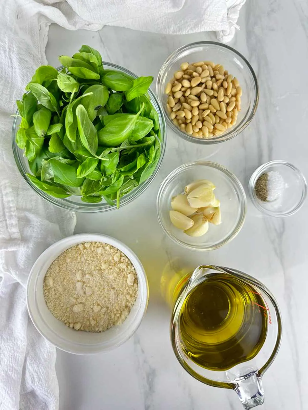 Ingredients for Traditional Pesto Genovese: Basil, Pine Nuts, Garlic, Parmesan Cheese, Olive Oil, Salt, and Pepper