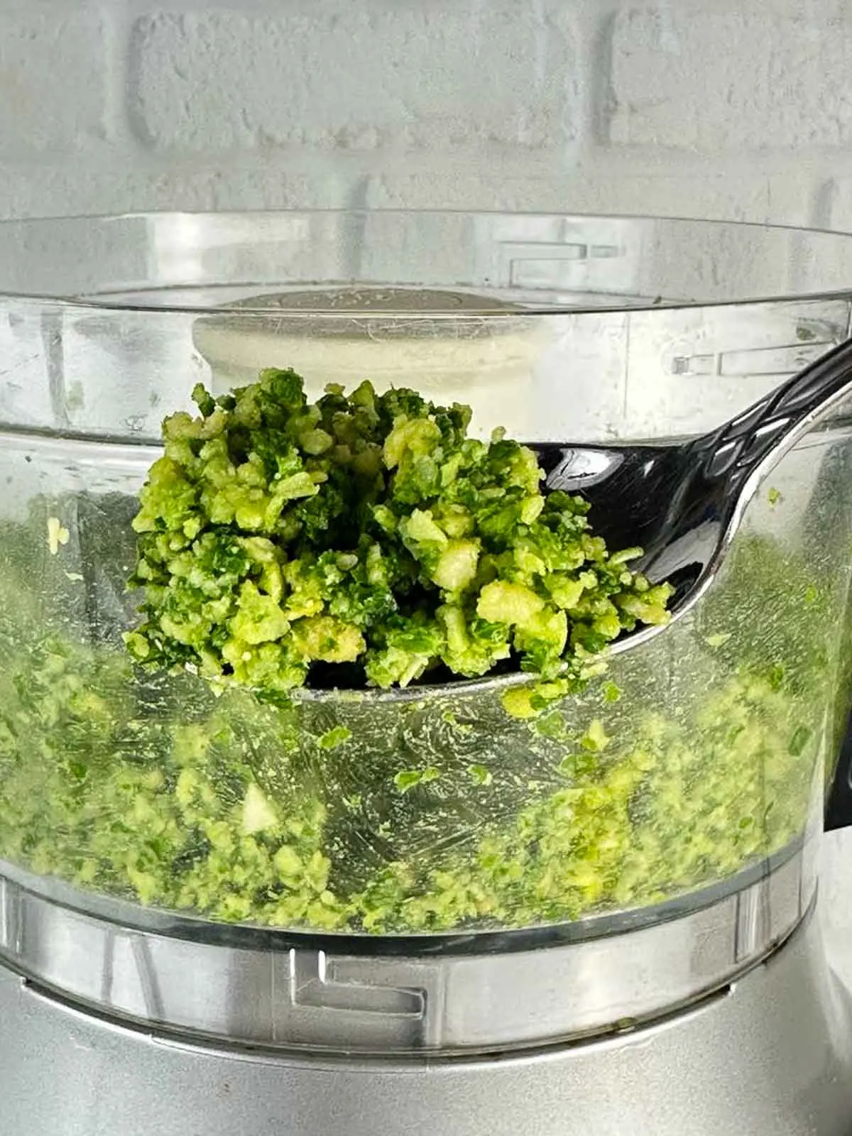 Pulse the food processor until the pesto makes a thick paste like consistency