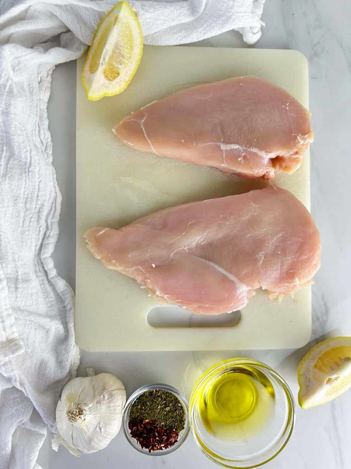 Ingredients for Italian Grilled Chicken: Chicken Breasts, Olive Oil, Lemon, Garlic, Spices