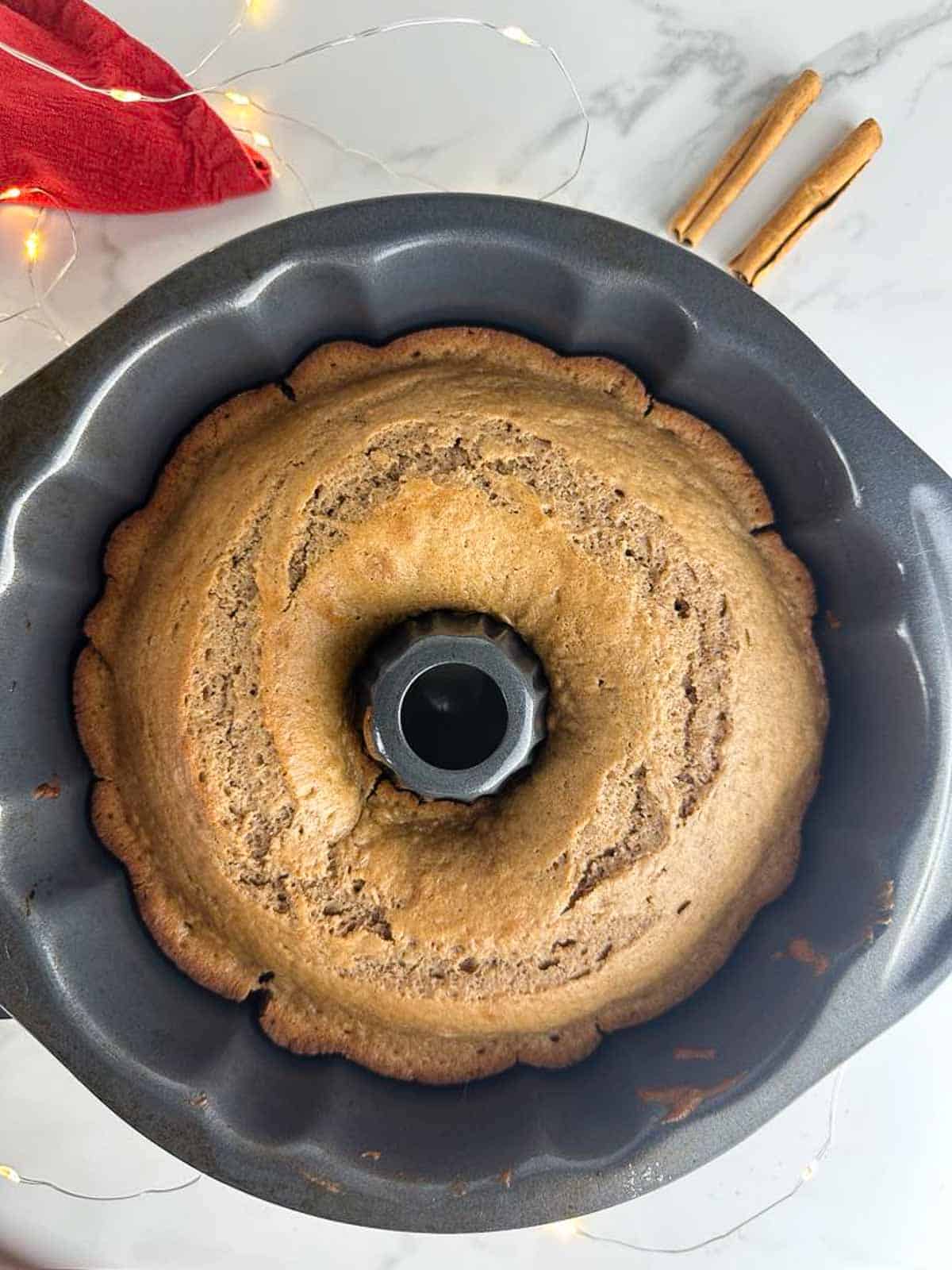 Baked apple cider cake in a bundt pan