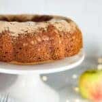 Apple Cider Donut dusted with cinnamon sugar cake on a cake stand