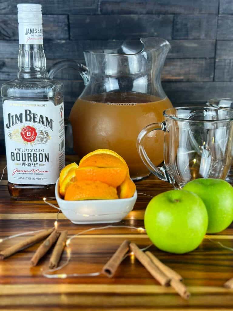 Ingredients for Hot Apple Cider Bourbon Cocktail: Bourbon, Apple Cider, Oranges, Cinnamon