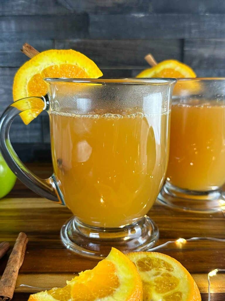 Pour the hot apple cider into the mug partially filled with bourbon.