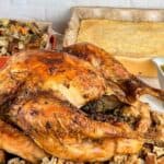 Turkey in a convection oven served with stuffing, cornbread, and gravy.