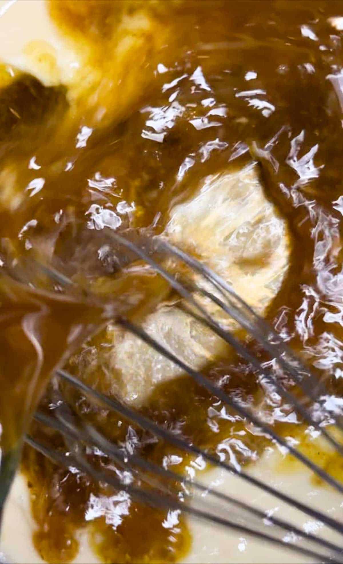 Whisk the pan drippings into the roux to make gravy from drippings