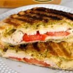 A photo of turkey pesto panini set into a text box reading turkey pesto paninis