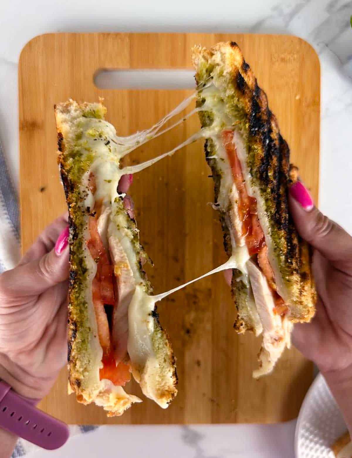 An ooey gooey turkey pesto panini