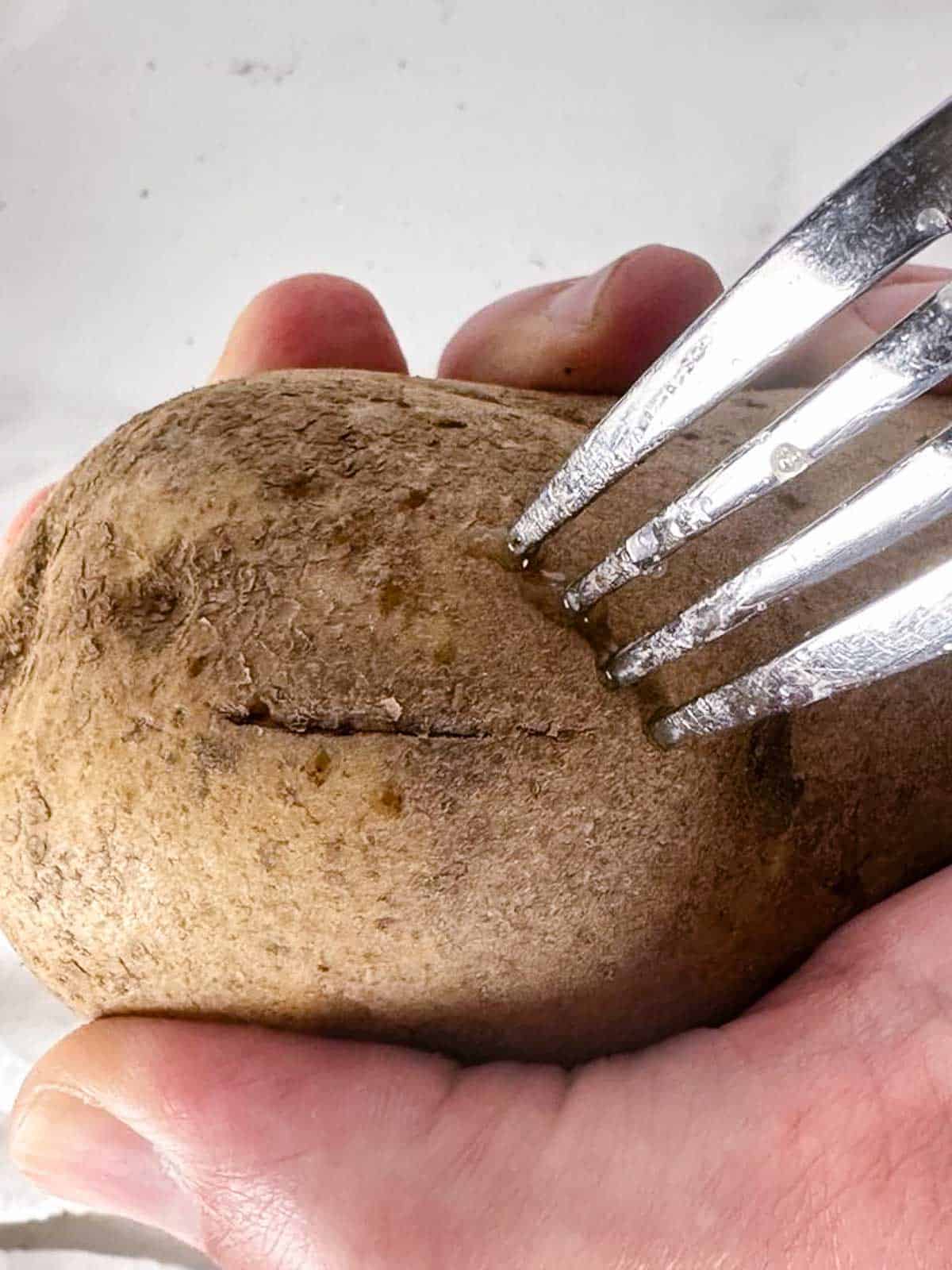 Prick the exterior of the potatoes with a fork before you bake them