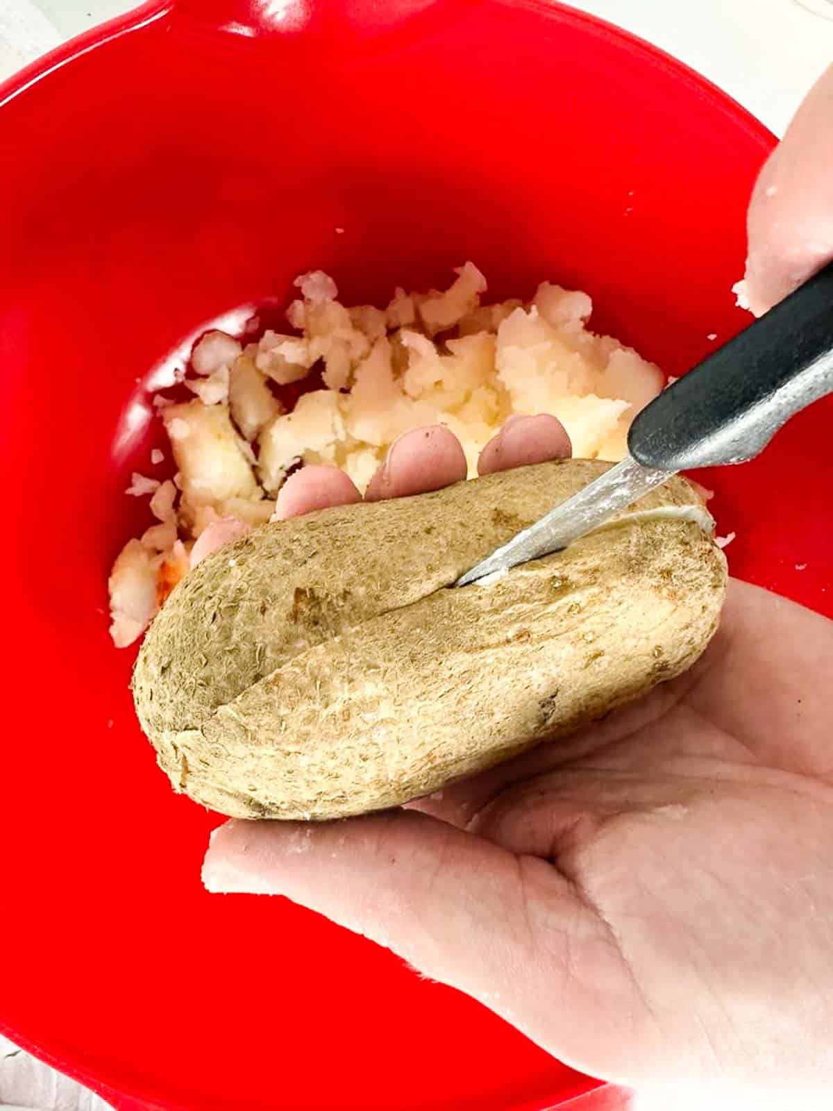 Cut the cooled baked potatoes in half and scoop out the interior