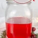 A photo of a jar of cranberry simple syrup set into a decorative text box that reads cranberry simple syrup